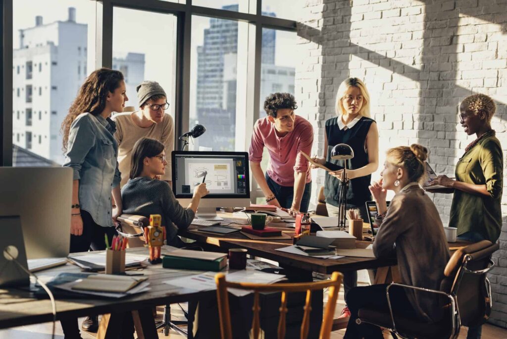 Team collaborating around a table in a modern office