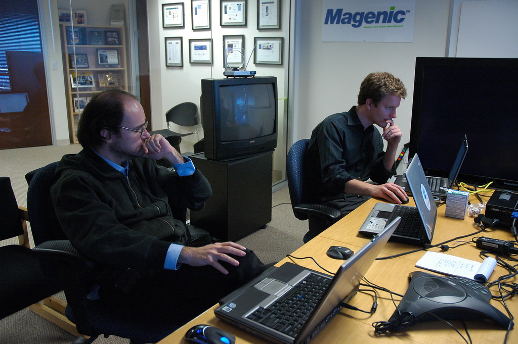 Two software development professionals working in an office