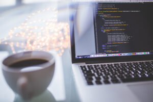 Laptop displaying a programmer's website development workspace